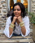 Gen z style jewellery, maximalist, floral golden cuffs