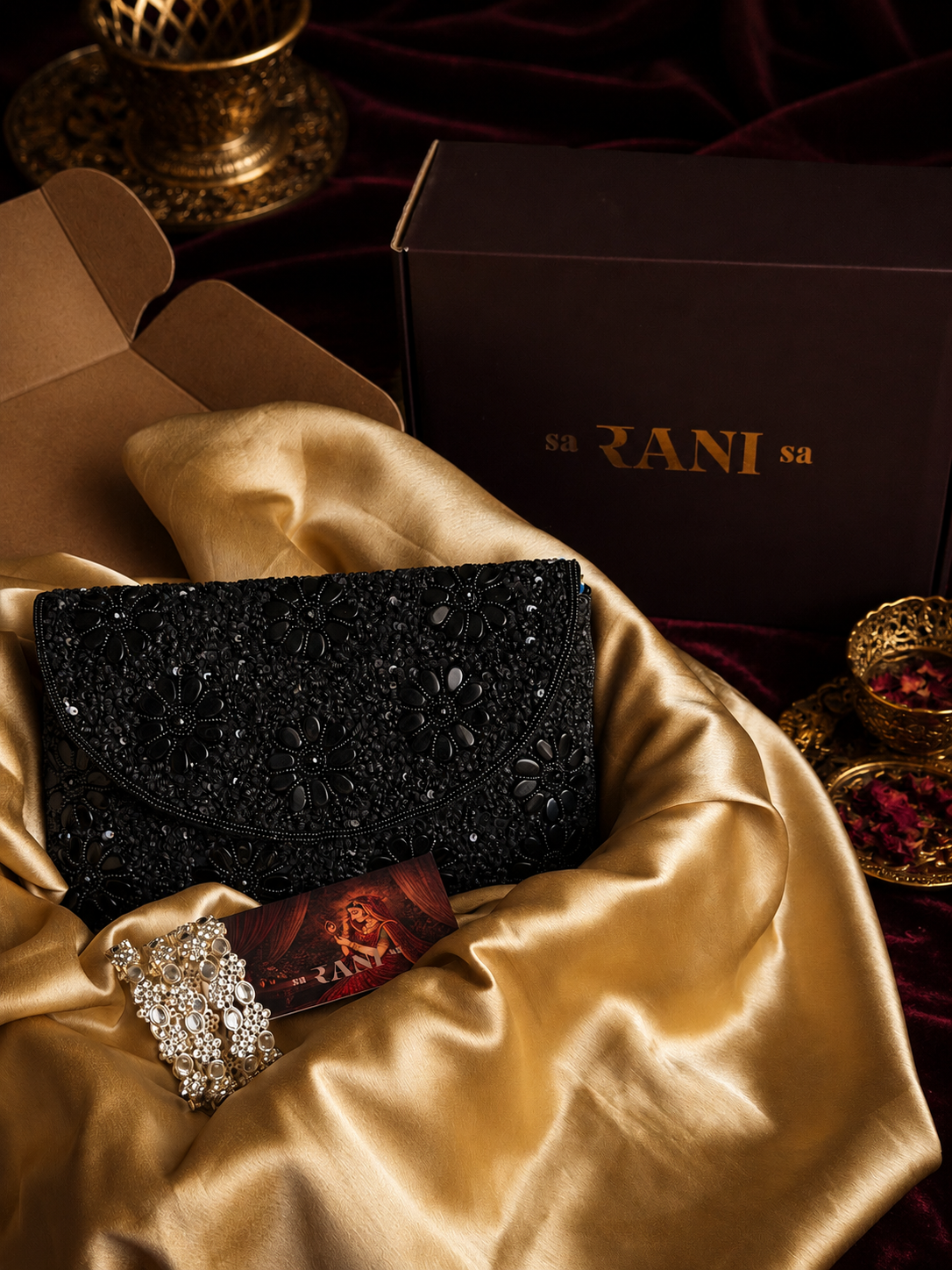 black embellished clutch, Indian clutch bag, pearl kundan bangles, Indian accessories Dubai, and Saranisa.
