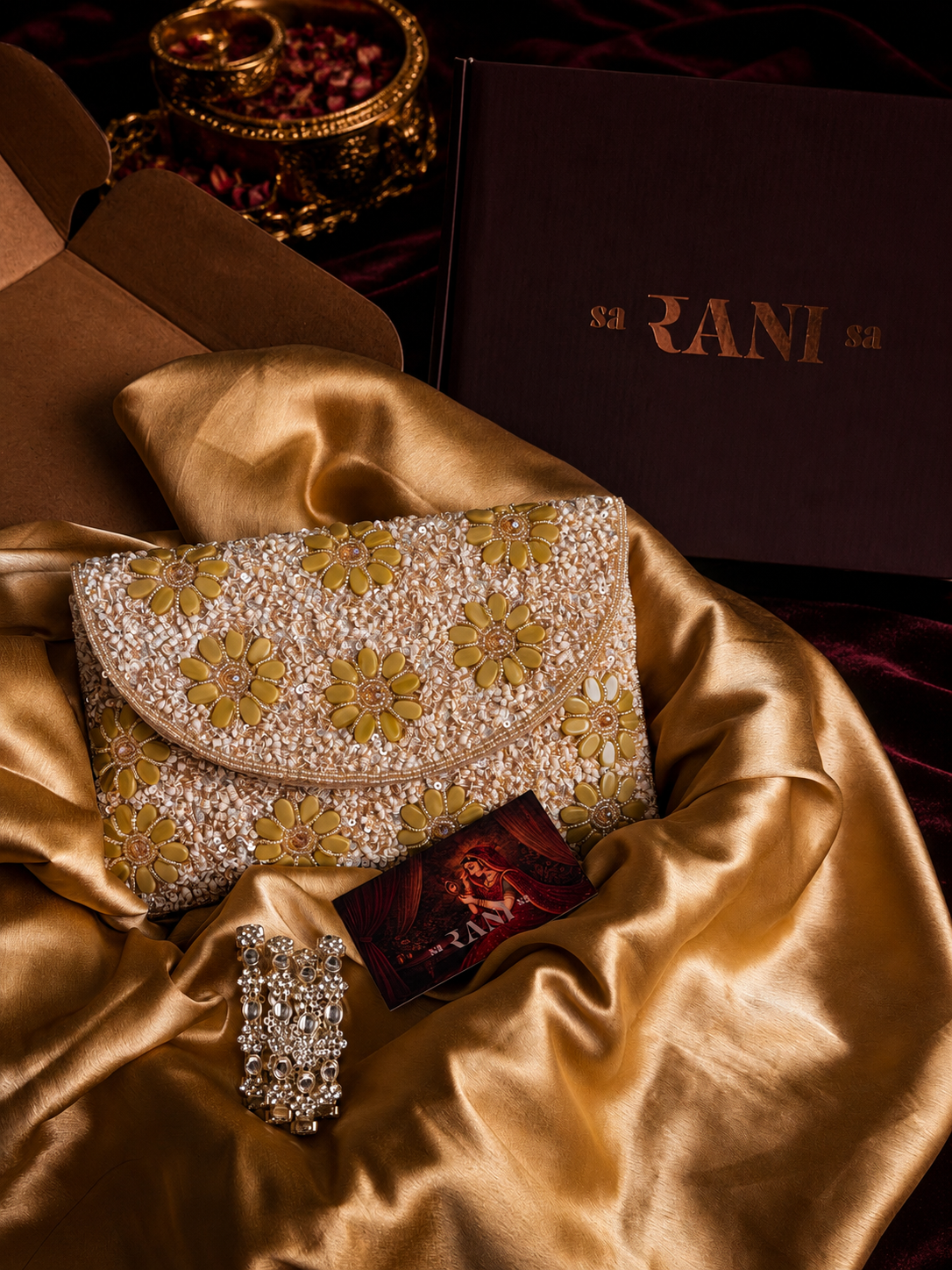 butter yellow floral embellished clutch with yellow flower detailing and pearl kundan bangles by Saranisa, Indian accessories in Dubai UAE