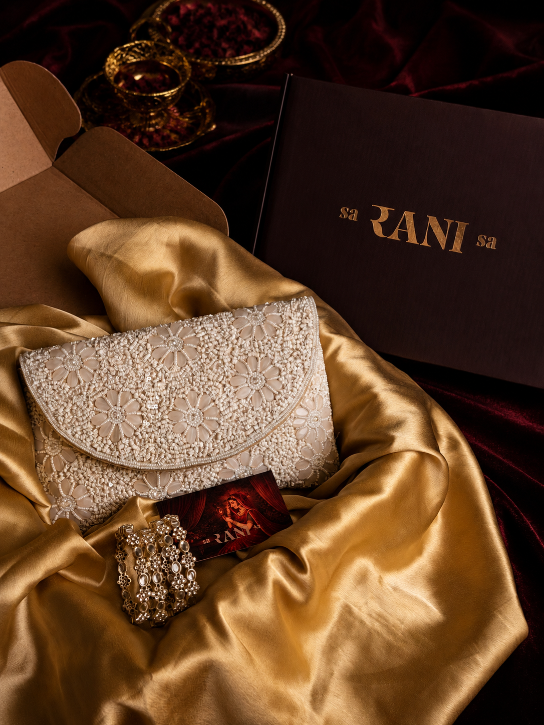 Ivory floral embellished clutch with pearl kundan bangles by Saranisa, Indian fashion accessories in Dubai UAE